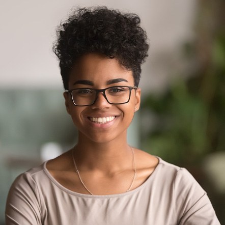 Closeup of teen girl with glasses smiling
