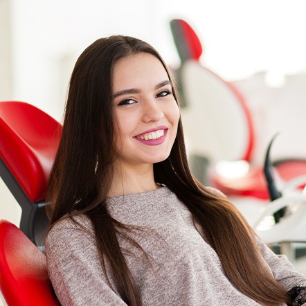Teen girl smiling in treatment chair