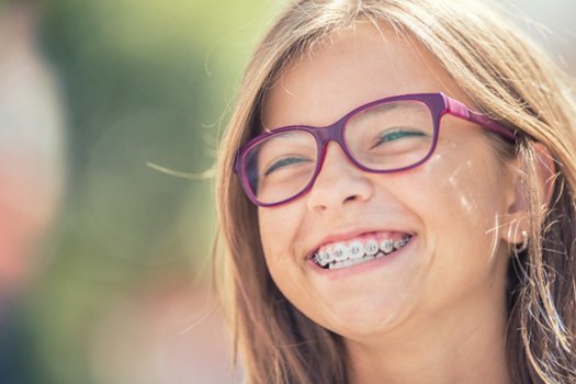 Patient in Blackhawk smiling after getting braces