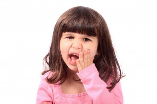 Patient in Blackhawk holding cheek due to tooth pain