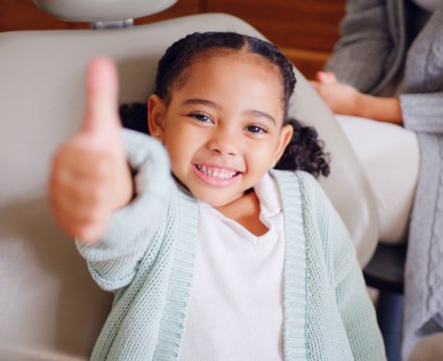 a child wearing a removable orthodontic appliance