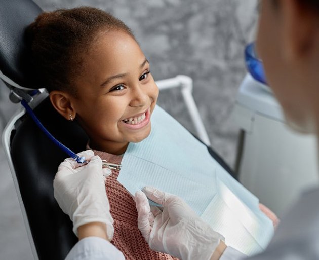 a boy smiling with straight teeth