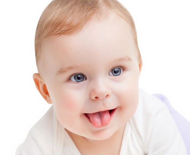 Baby sticking its tongue out