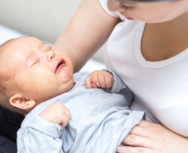 Mother comforting her fussy baby